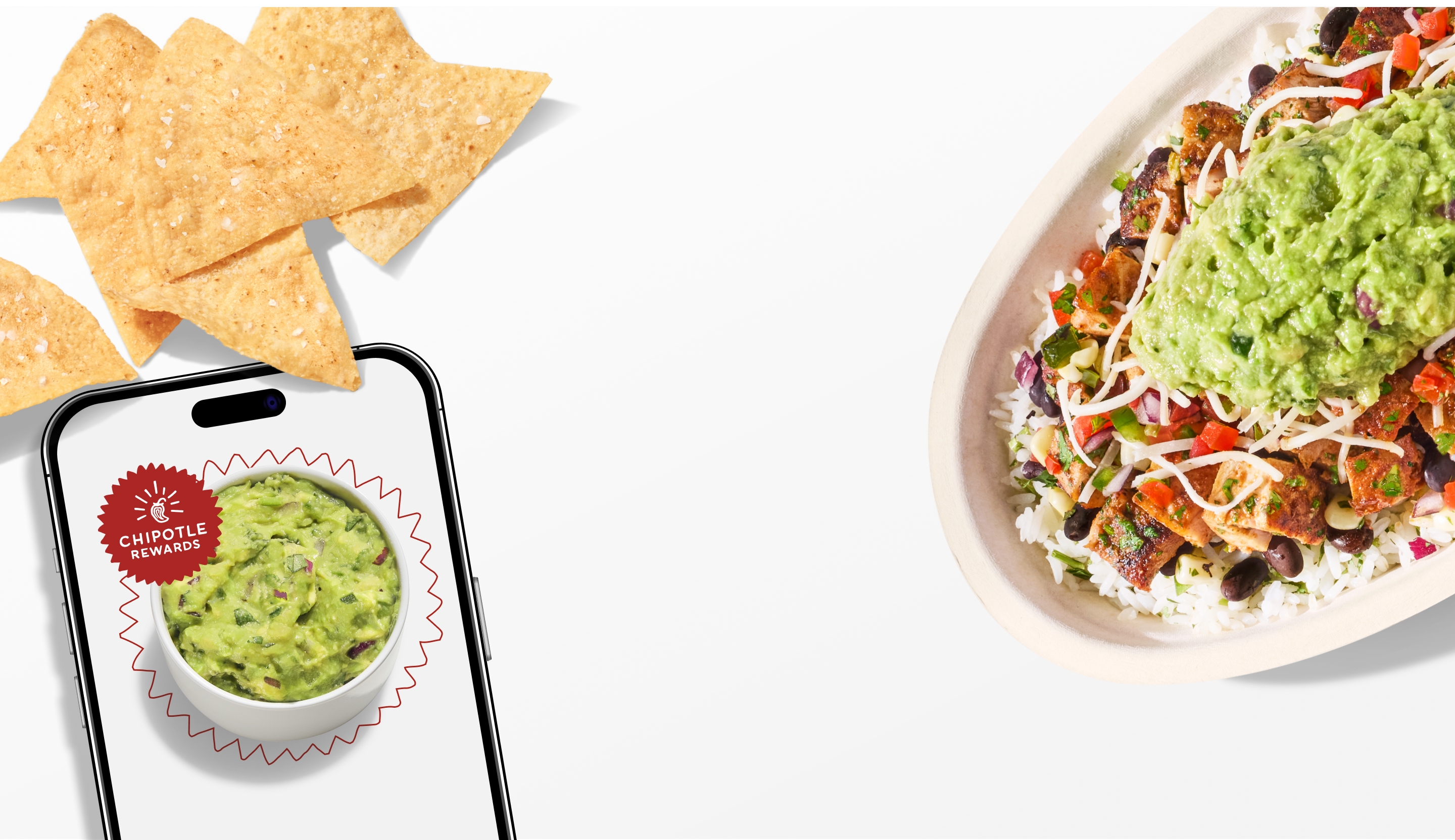 A side of fresh made Guacamole on a phone and a Chipotle Pollo Asado Burrito Bowl with a side of freshly made Chips.