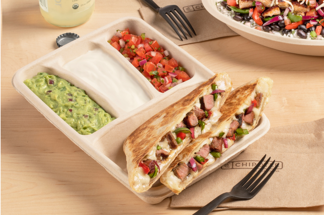 A Carne Asada Quesadilla from Chipotle with a side of Guacamole, Sour Cream, and Fresh Tomato Salsa.