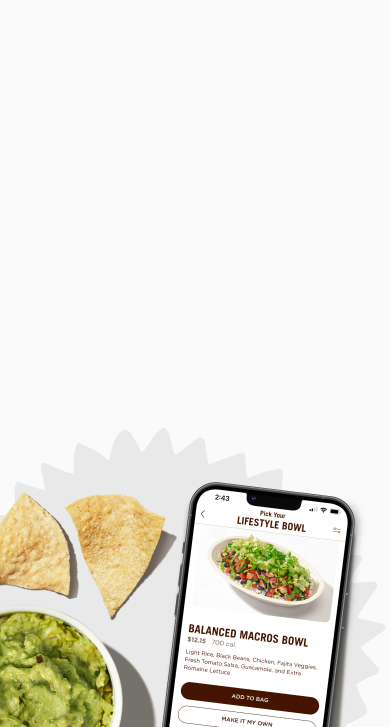 Side of chips and guacamole with a smartphone viewing Lifestyle Bowls on the Chipotle app.