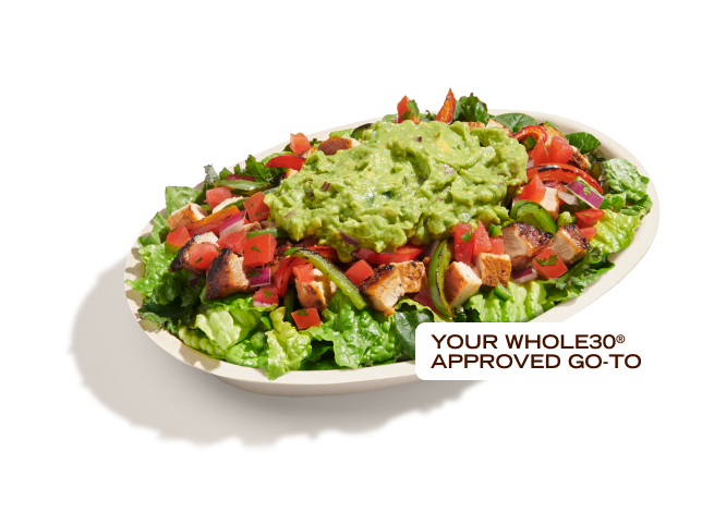 A Wholesome Lifestyle Bowl with guacamole, tomato salsa, fajita peppers, and supergreens salad. Your Whole30 Approved go-to.